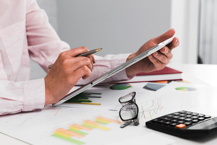 How can a firm improve its profit margins through outsourcing?